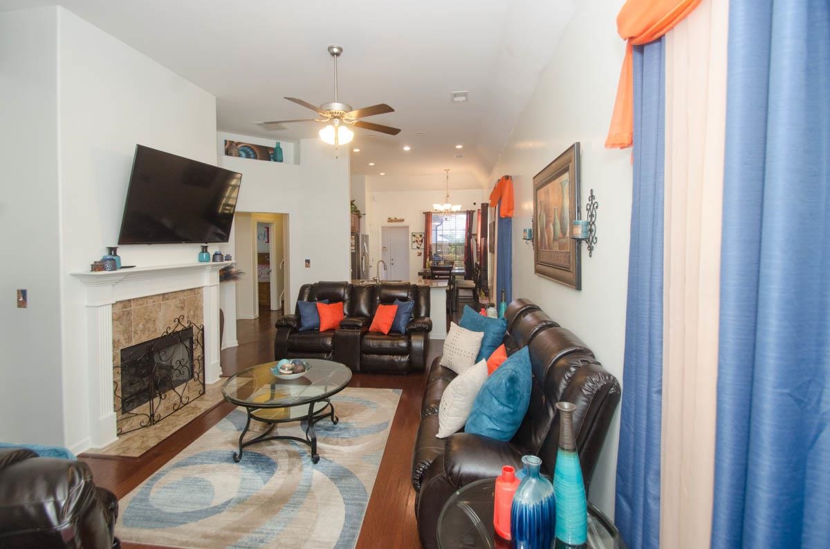 6905 Raleigh Lagrange Road Cordova, TN 38018 - Photo 3 of 17 a living room with furniture a fireplace and a flat screen tv