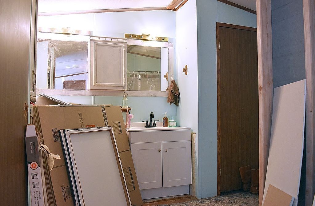 1661 Sassafras Stand Ridge Road Linden, TN 37096 - Photo 7 of 23 a bathroom with a sink a vanity and a mirror