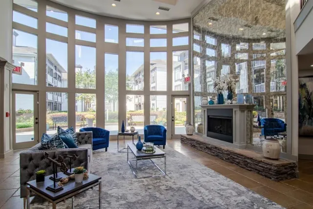 a living room with furniture and a fireplace