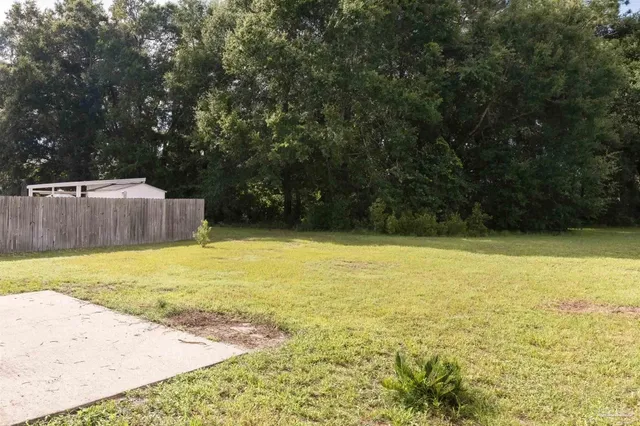 a view of a swimming pool with an outdoor space and seating area