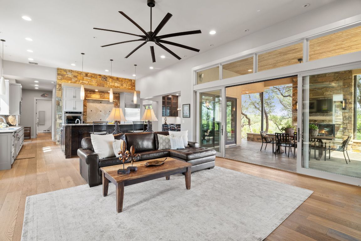 11400 Crumley Ranch Road Austin, TX 78738 - Photo 11 of 39 a living room with furniture pool table and a large window