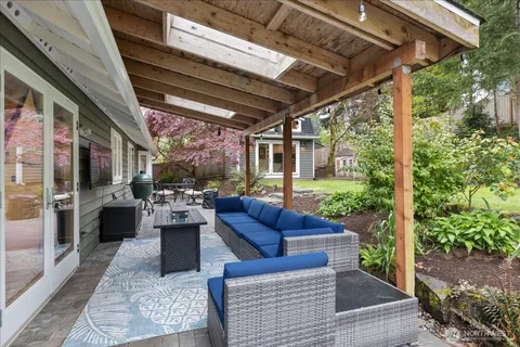 a view of a patio with couches and potted plants