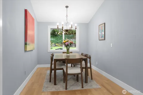 a view of a dining room with furniture window and outside view