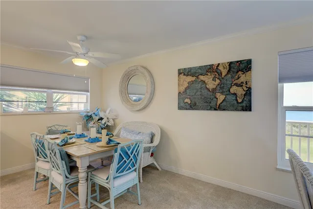 a dining room with furniture a window and wooden floor
