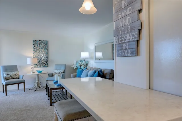 a living room with furniture a ceiling fan and a window