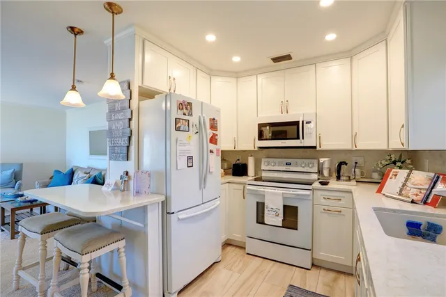 a bathroom with a sink and a large mirror