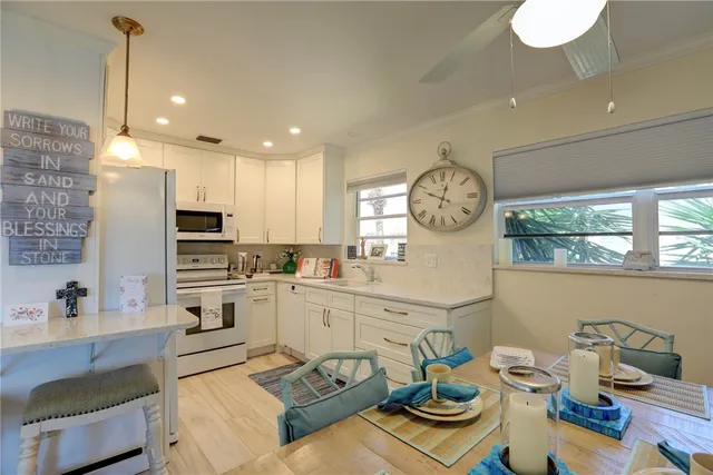 a living room with kitchen island furniture and a clock