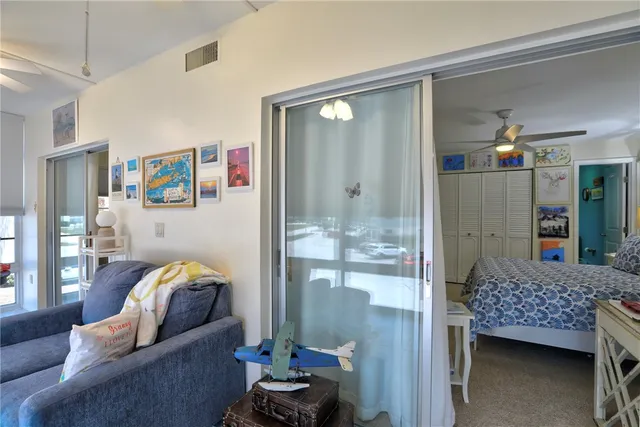 a bedroom with furniture and a window