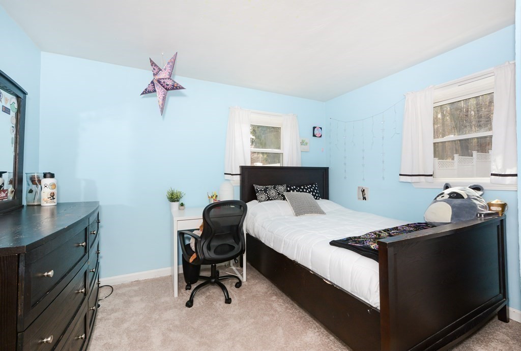 107 Causeway Street Hudson, MA 01749 - Photo 14 of 21 a bedroom with a bed and a desk