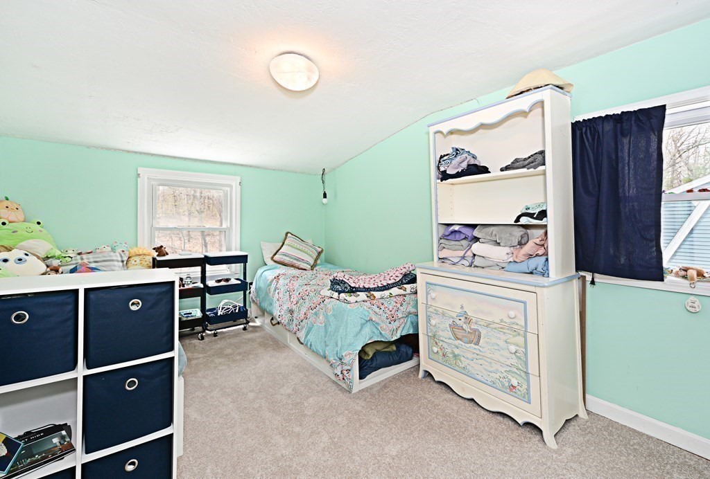 107 Causeway Street Hudson, MA 01749 - Photo 19 of 21 a bed room with a bed and a window