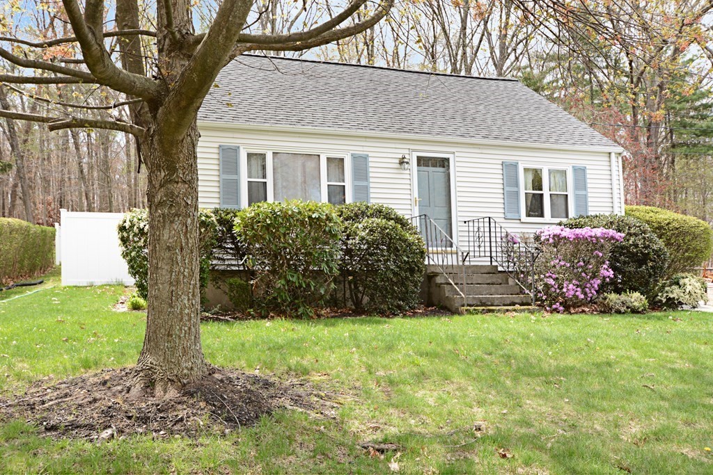 107 Causeway Street Hudson, MA 01749 - Photo 2 of 21 a front view of house with yard and green space