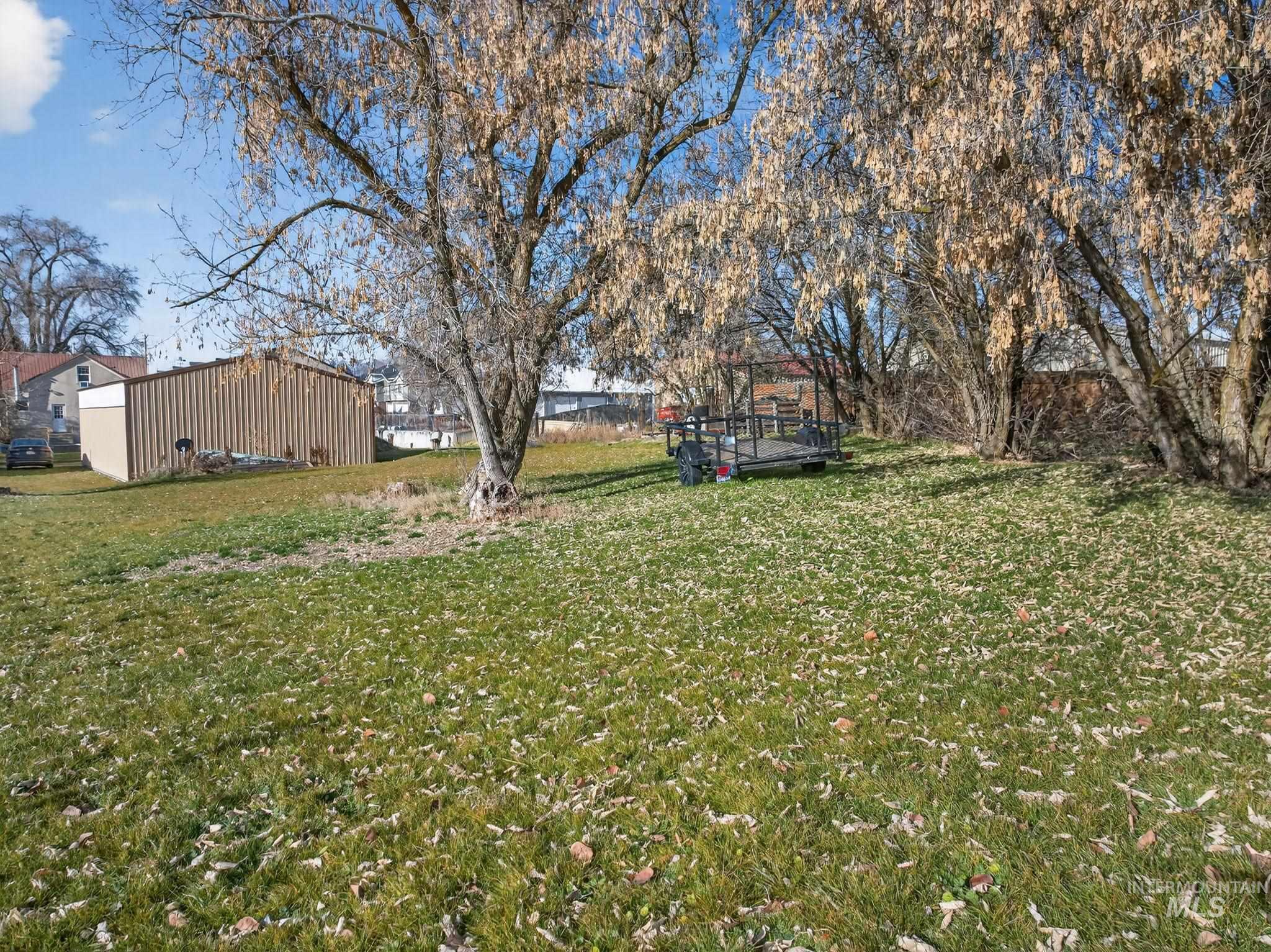 49 South 4th Street West Preston, ID 83263 - Photo 30 of 48 View of green lawn with a pole building and an outbuilding