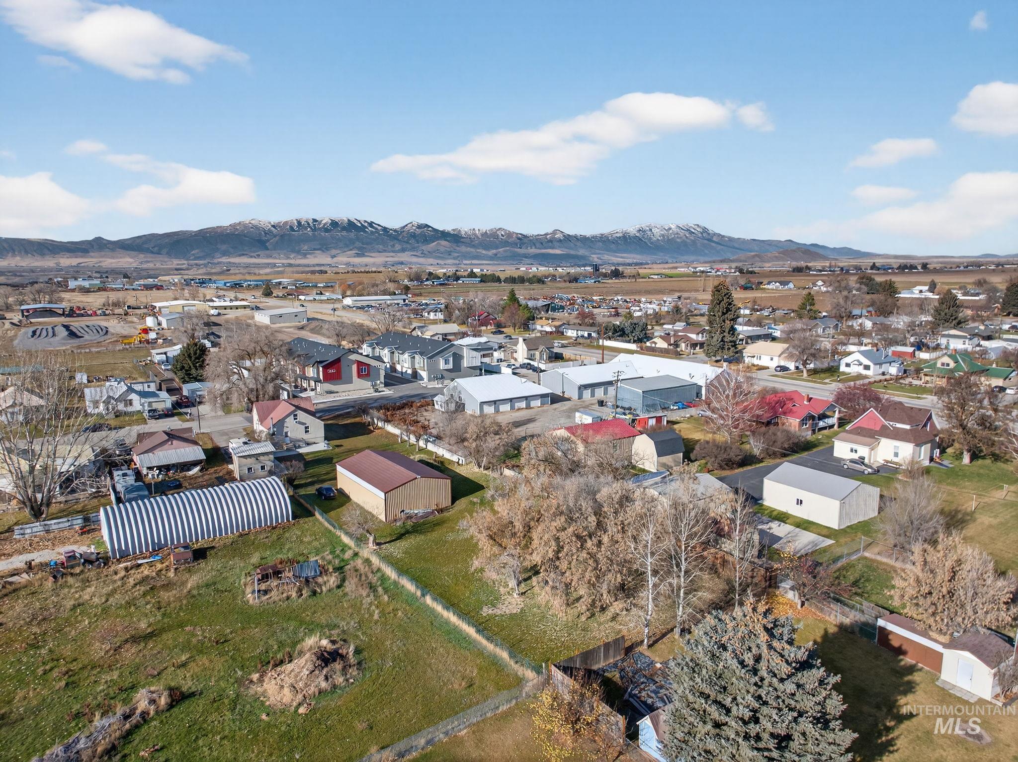 49 South 4th Street West Preston, ID 83263 - Photo 38 of 48 Aerial view of residential area with a mountain backdrop