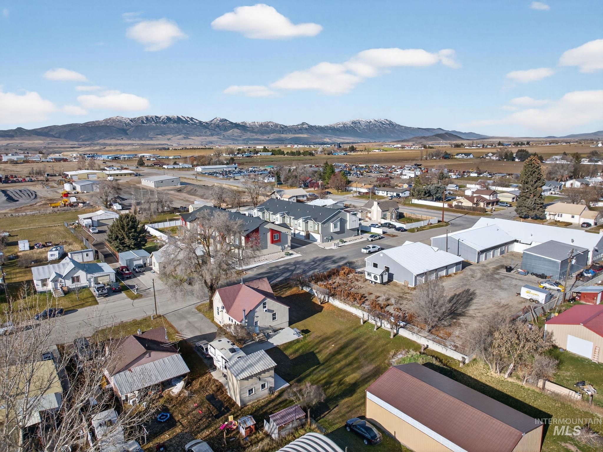 49 South 4th Street West Preston, ID 83263 - Photo 40 of 48 Aerial perspective of suburban area with a mountain backdrop