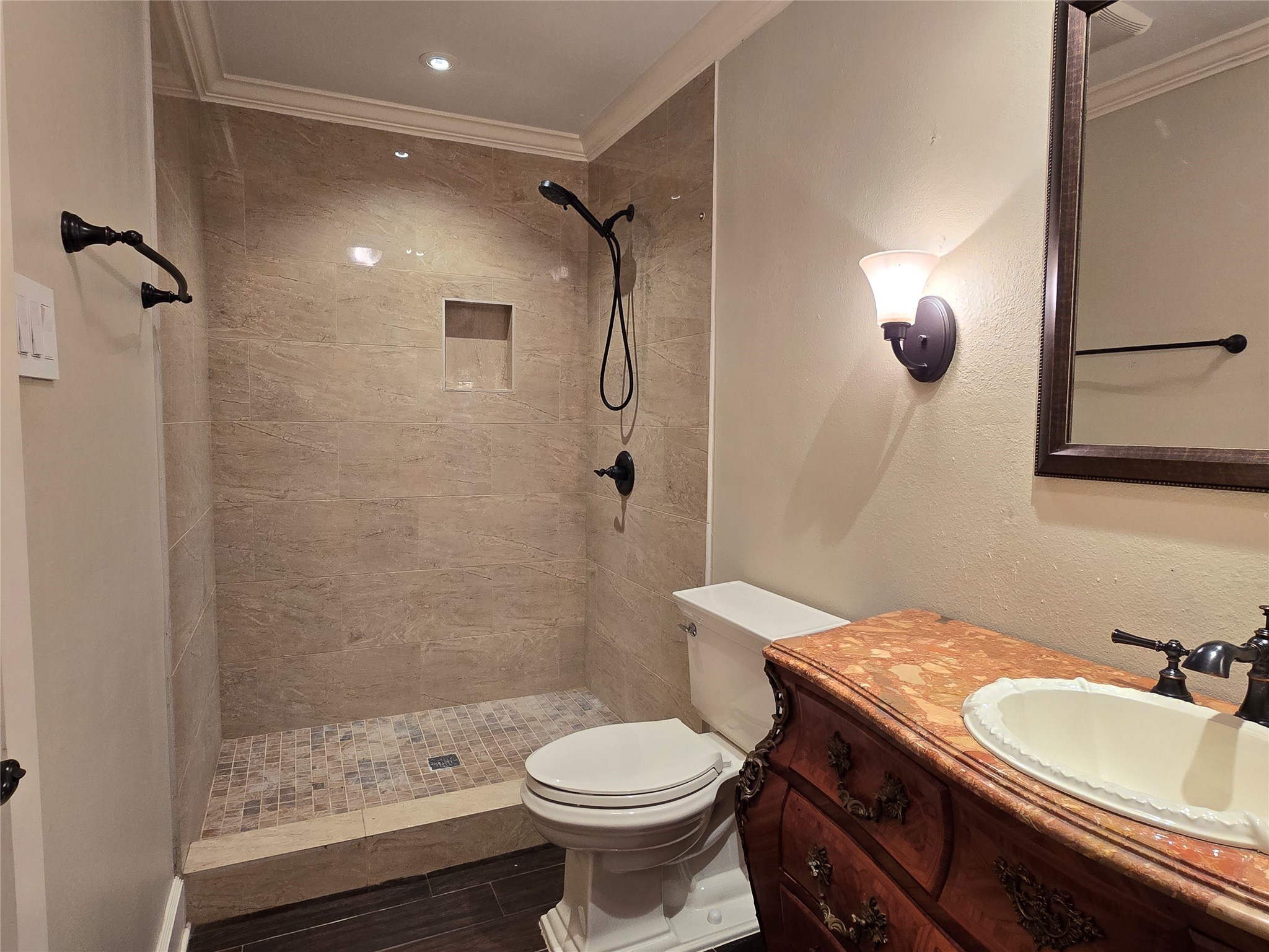 11550 Chimney Rock Road, Unit 312 Houston, TX 77035 - Photo 11 of 18 a bathroom with a sink toilet and shower