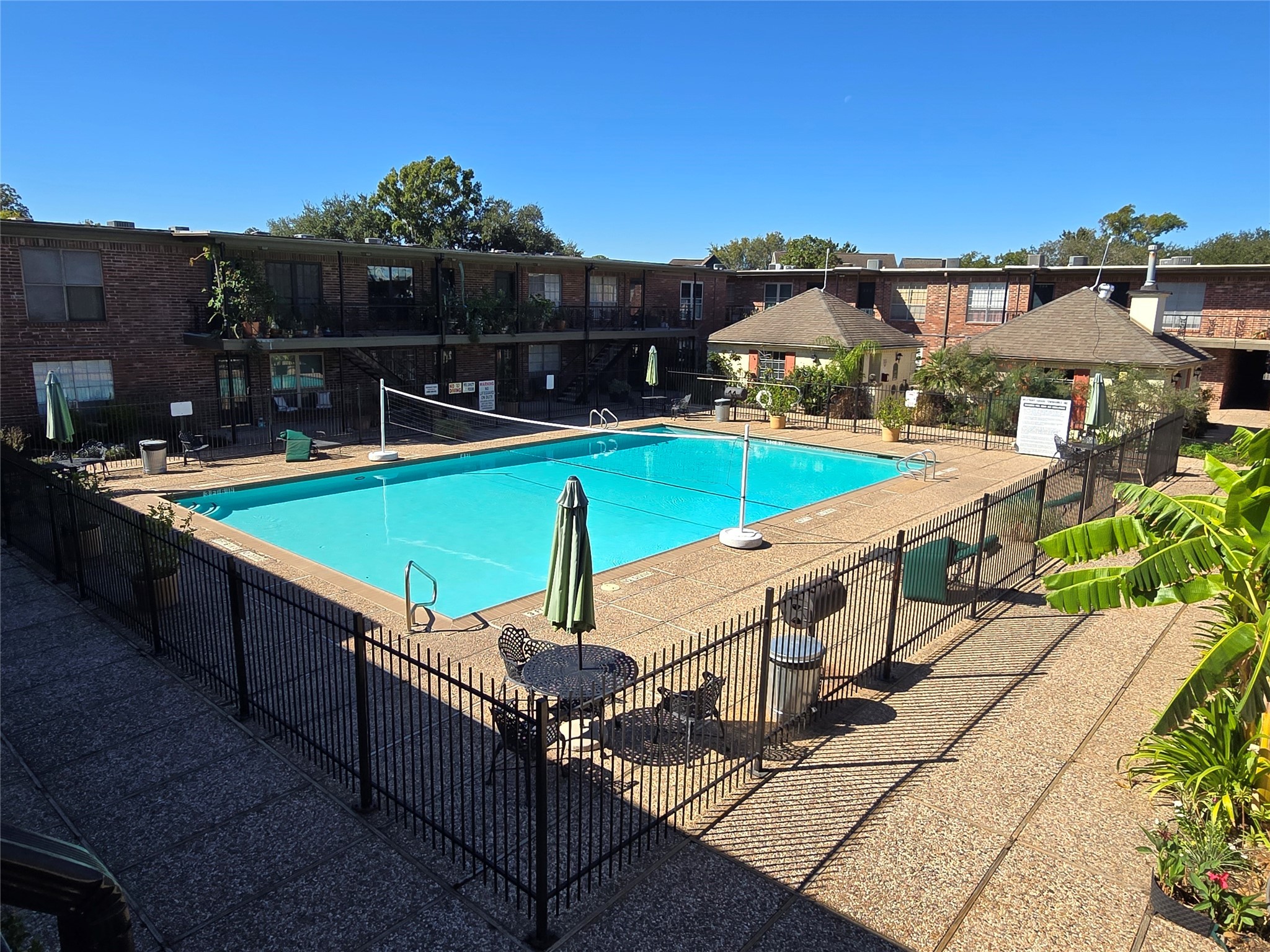 11550 Chimney Rock Road, Unit 312 Houston, TX 77035 - Photo 15 of 18 a view of a chairs and table on the terrace