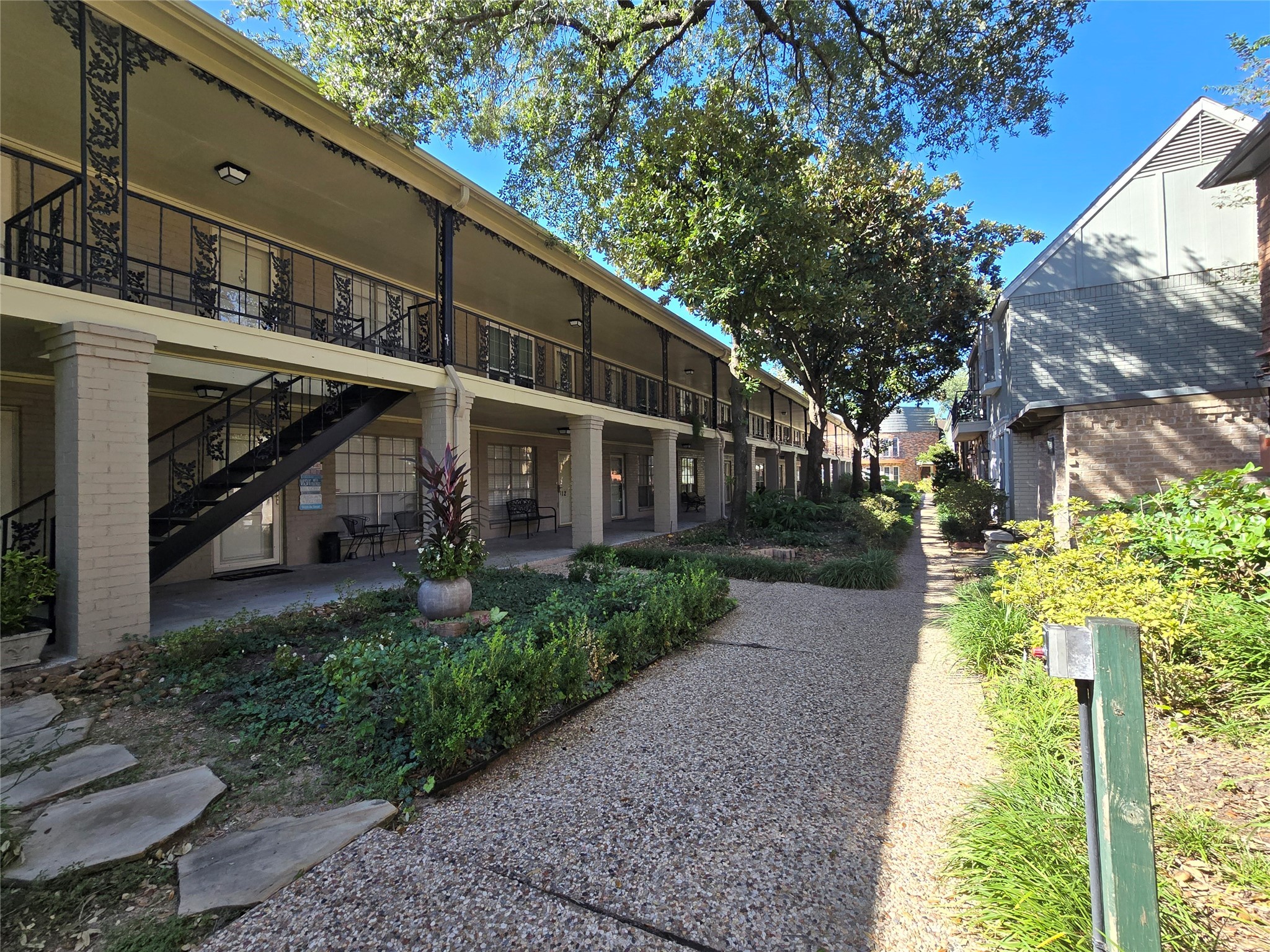 11550 Chimney Rock Road, Unit 312 Houston, TX 77035 - Photo 3 of 18 a view of a patio with table and chairs and potted plants