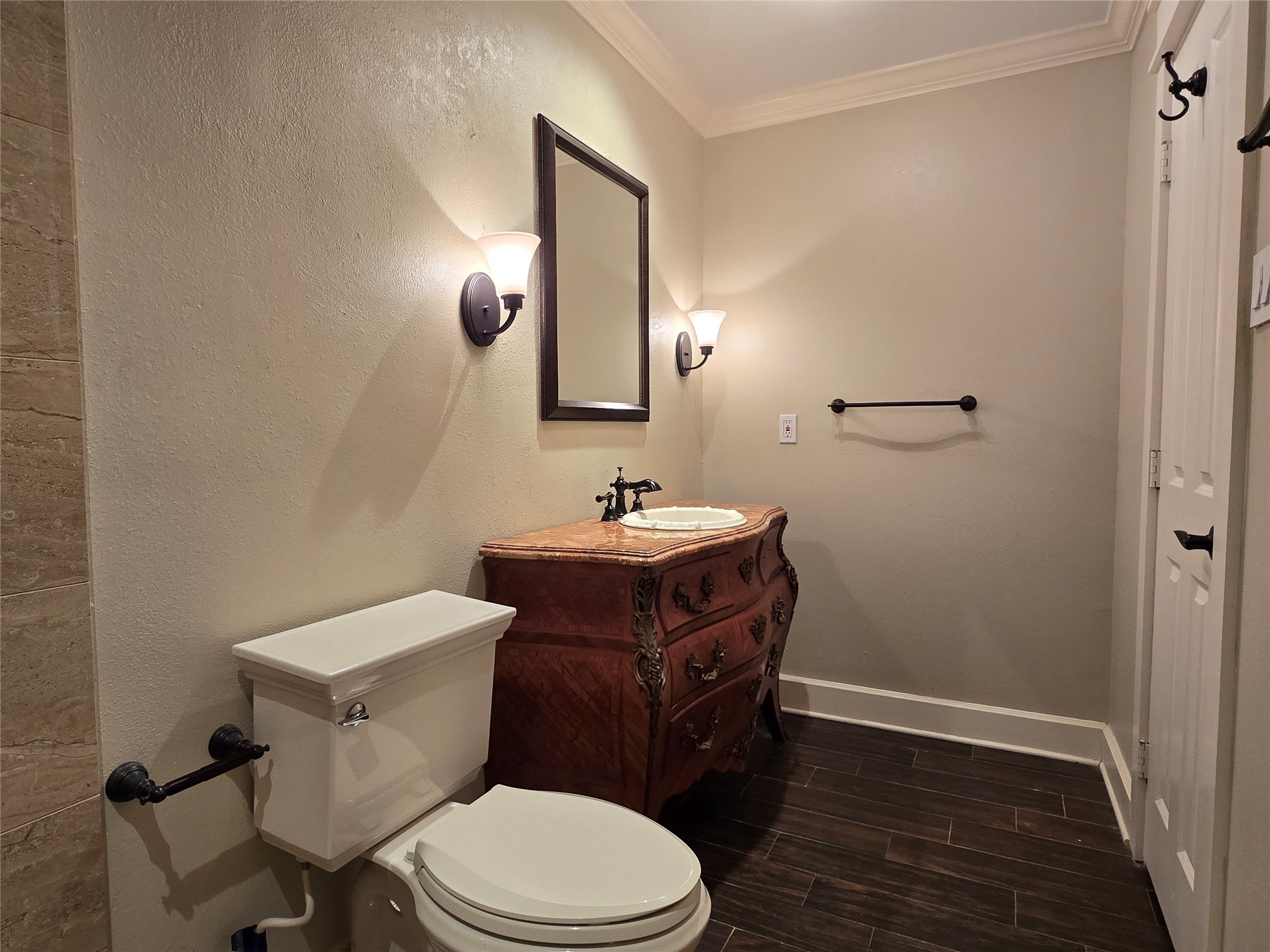 11550 Chimney Rock Road, Unit 312 Houston, TX 77035 - Photo 10 of 18 a bathroom with a toilet a sink and mirror