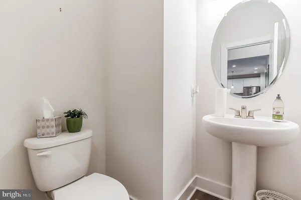 a living room with furniture fireplace and a large window