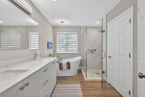 a white bath tub sitting in a bathroom