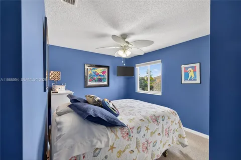 a bathroom with a double vanity sink toilet and shower