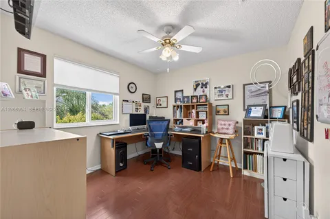 a view of entryway with furniture and wooden floor