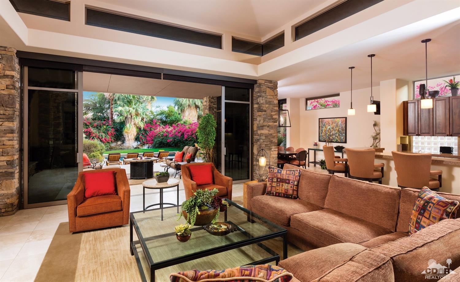 810 Shadow Vista Palm Desert, CA 92260 - Photo 2 of 11 a living room with furniture and a flat screen tv