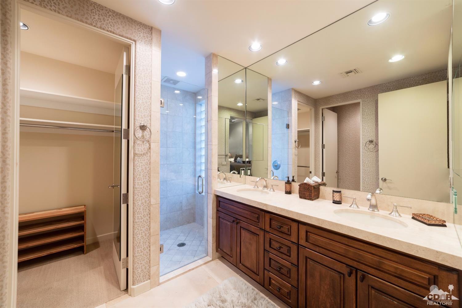 810 Shadow Vista Palm Desert, CA 92260 - Photo 11 of 11 a bathroom with double vanity sinks and a shower