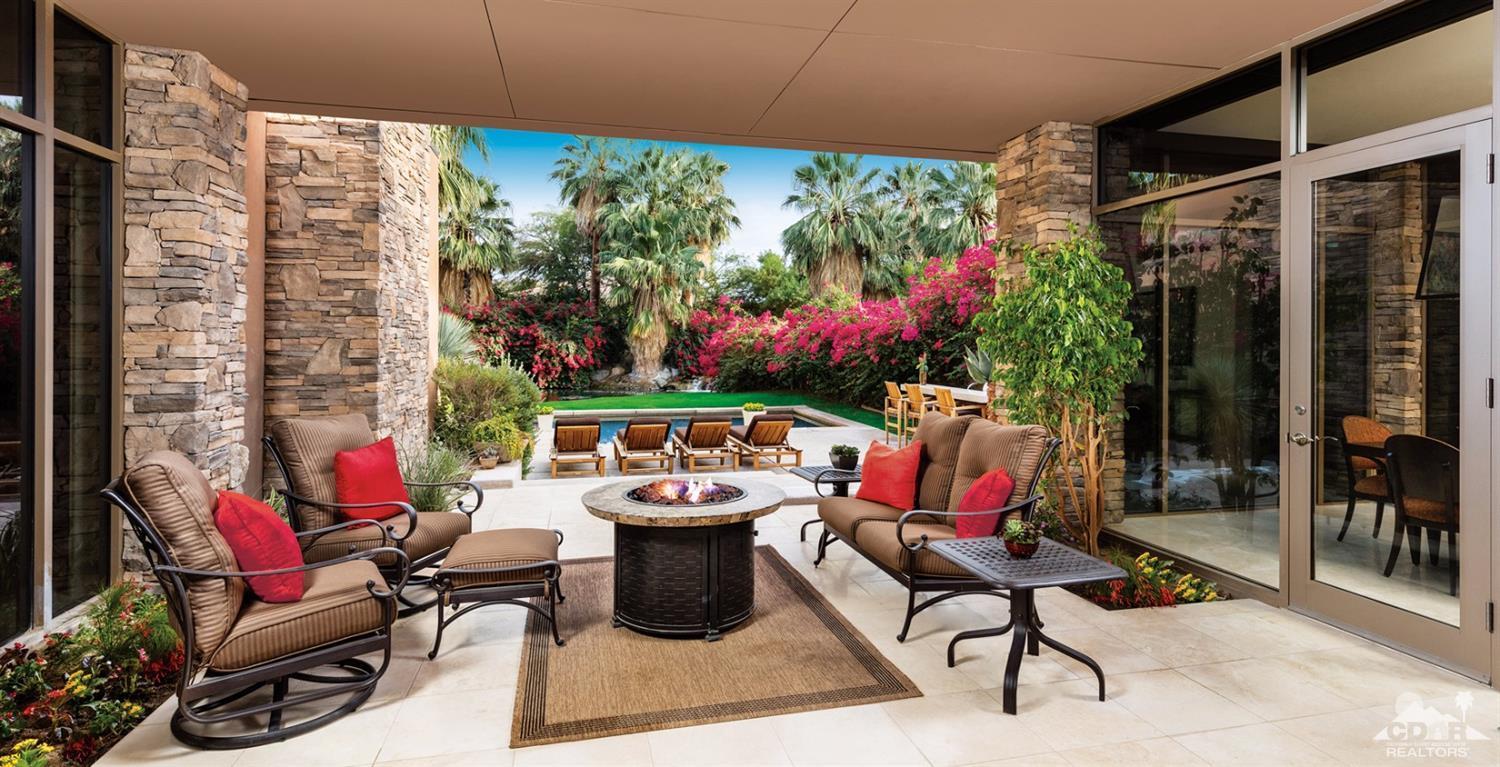810 Shadow Vista Palm Desert, CA 92260 - Photo 3 of 11 a outdoor living space with furniture and garden view