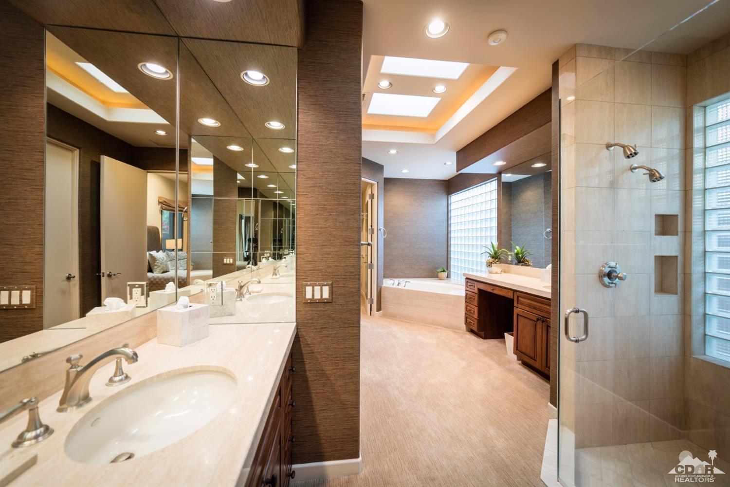 810 Shadow Vista Palm Desert, CA 92260 - Photo 8 of 11 a bathroom with a tub sink shower and mirror