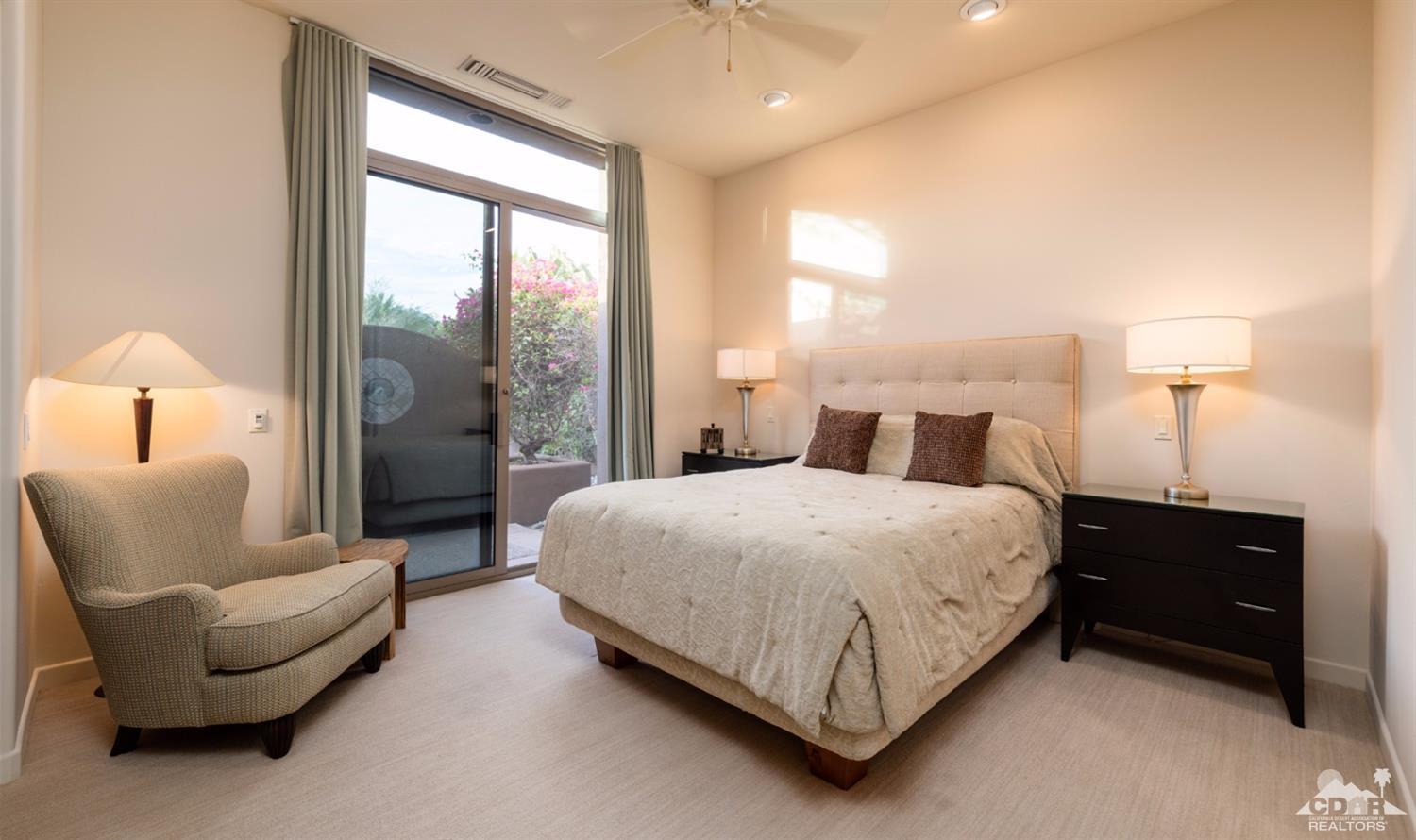 810 Shadow Vista Palm Desert, CA 92260 - Photo 9 of 11 a bedroom with a bed and a couch