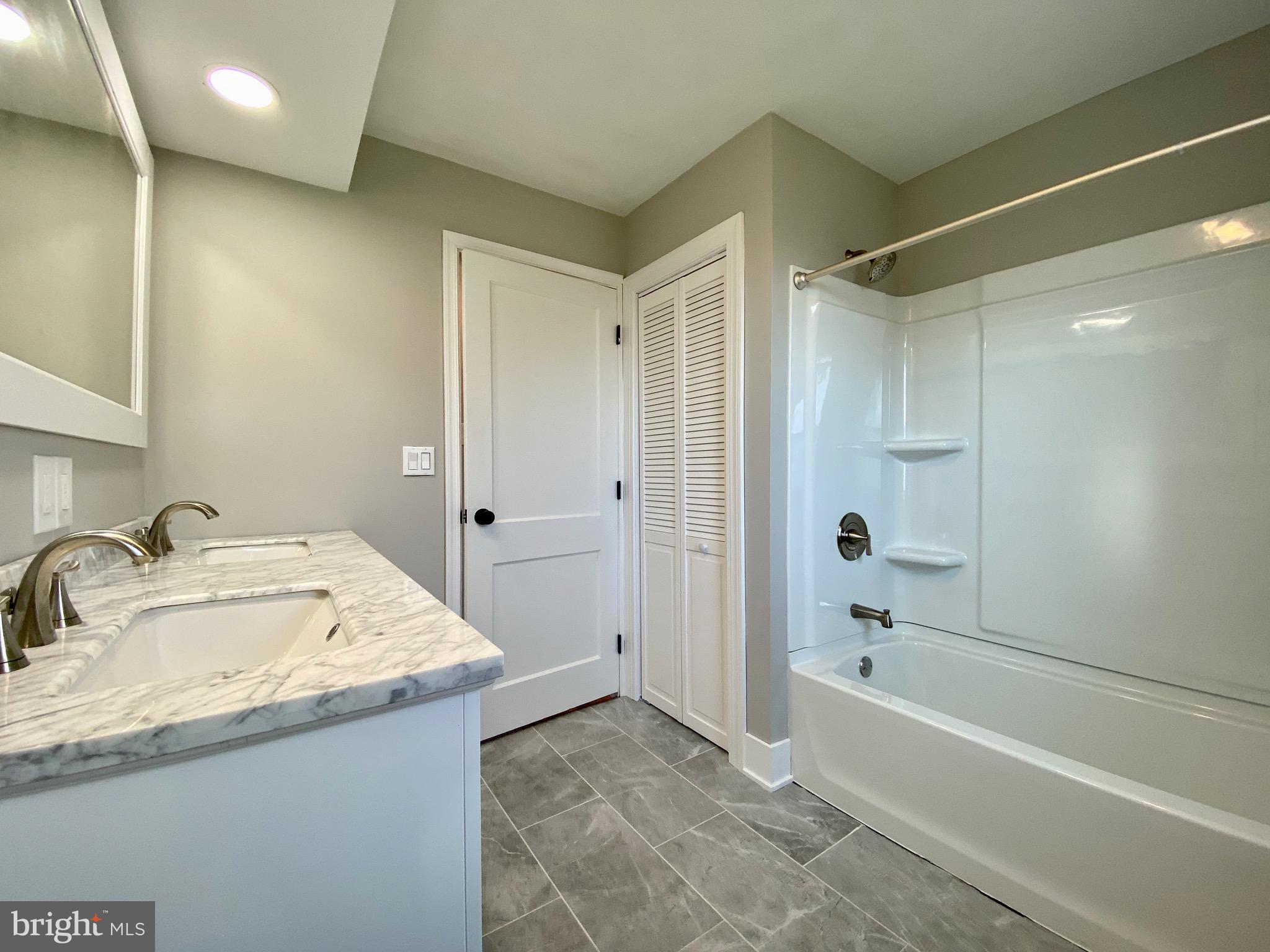 4475 East Prospect Road York, PA 17406 - Photo 15 of 29 Main Bath tile floor and Tub/shower