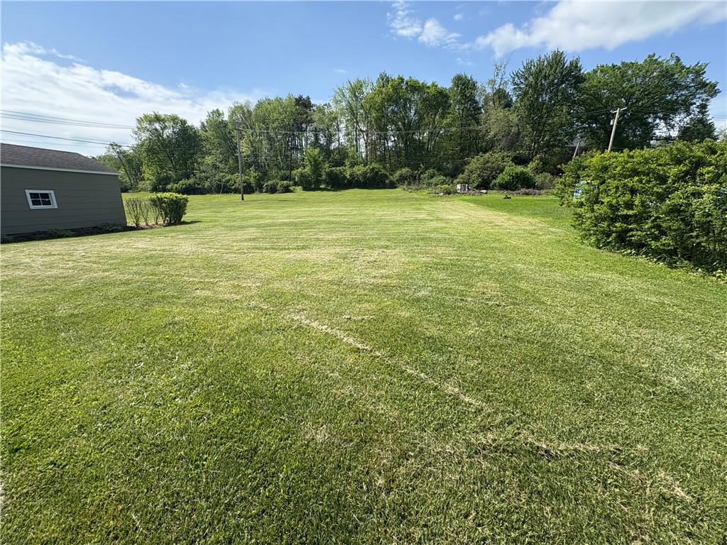 122 Browns Hill Road Valencia, PA 16059 - Photo 5 of 18 a view of a green field with trees in the background