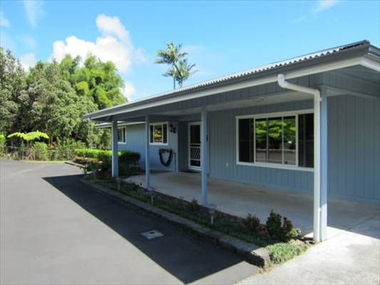 18-3976 Canney Road Mountain View, HI 96771 - Photo 2 of 25 a front view of a house with garden