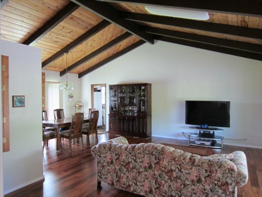 18-3976 Canney Road Mountain View, HI 96771 - Photo 4 of 25 a living room with furniture and a flat screen tv