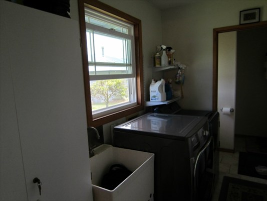 18-3976 Canney Road Mountain View, HI 96771 - Photo 5 of 25 a kitchen with a sink a stove and a window