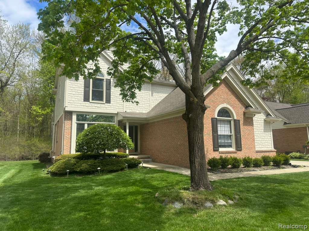 1154 Bluebird Drive Rochester, MI 48307 - Photo 3 of 34 Brick and shingle exterior with mature trees
