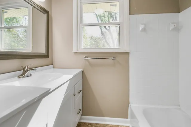 a bathroom with a sink and a bathtub