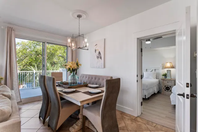 a bedroom with a bed a window and dresser