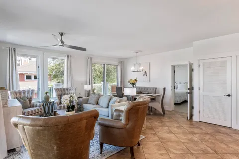 a bedroom with a large bed and a large window