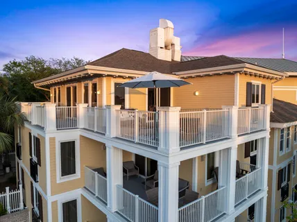 a view of a roof deck with wooden floor and fence