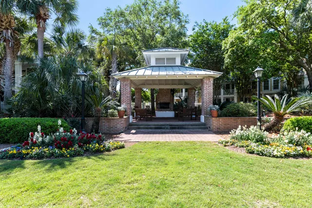 a view of a swimming pool with a chair and tables