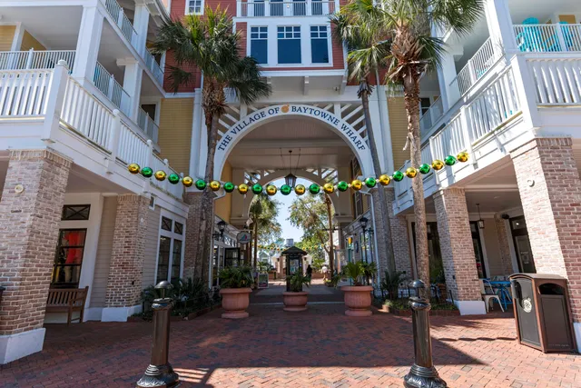 a view of a backyard with table and chairs and a large tree