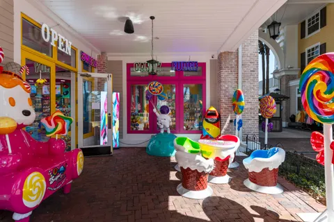 an aerial view of a houses with a lake