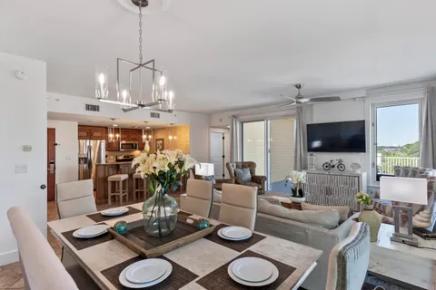 a large kitchen with a table and chairs