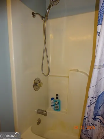 a bathroom with a bath tub