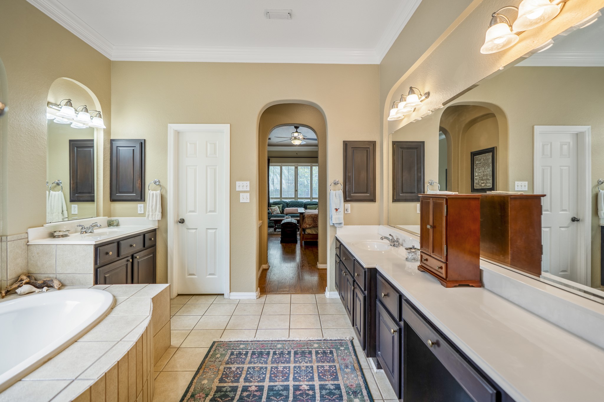 1438 Hatchmere Place Spring, TX 77379 - Photo 20 of 50 Luxurious primary bath offers dual vanities, dual-head shower, tiled flooring and a tile surround around the whirlpool soaking tub.