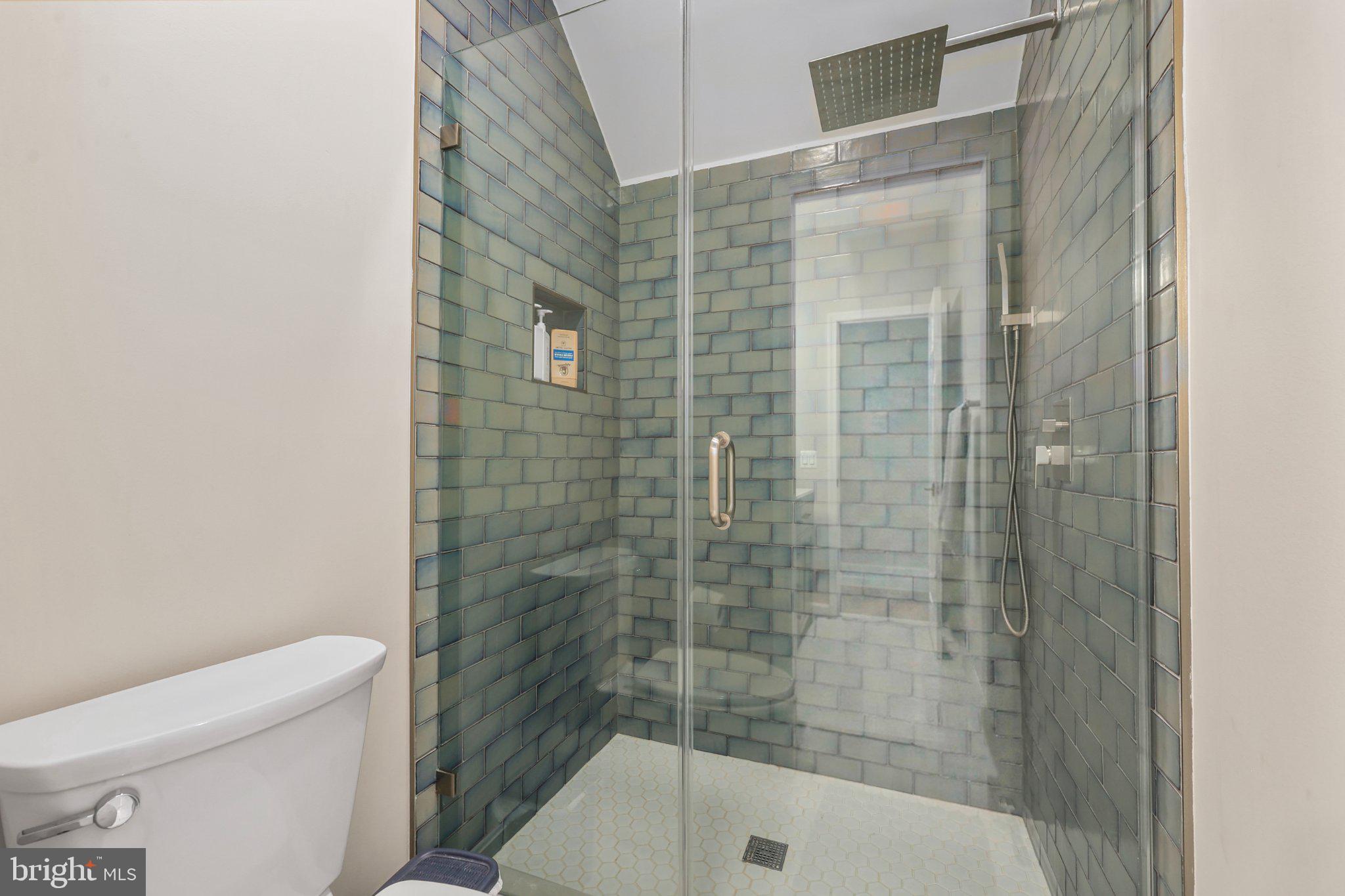 6732 Churchill Road McLean, VA 22101 - Photo 49 of 71 Sleek modern shower with stylish tiles.
