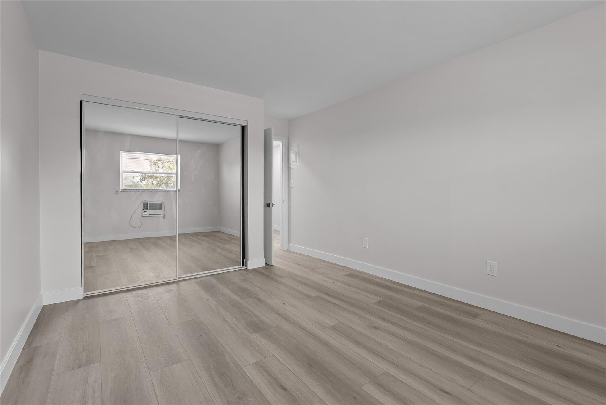 1150 East Sample Road, Unit 202 Pompano Beach, FL 33064 - Photo 12 of 20 a view of an empty room and window