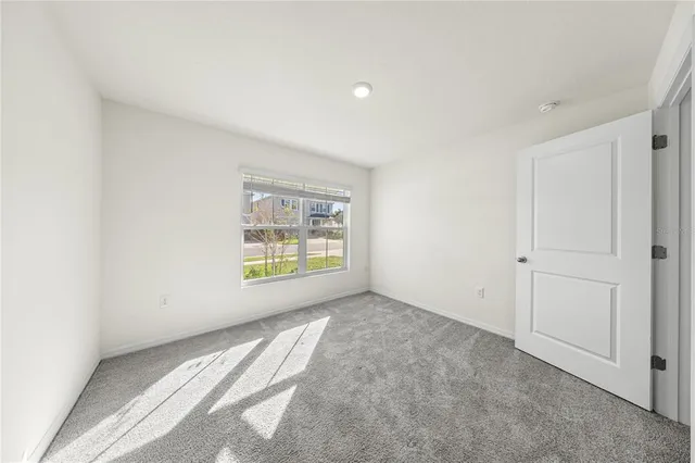 a view of an empty room and window